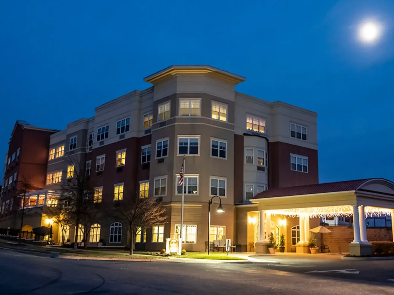 Completed multi-story ThermaSteel building lit up at dusk