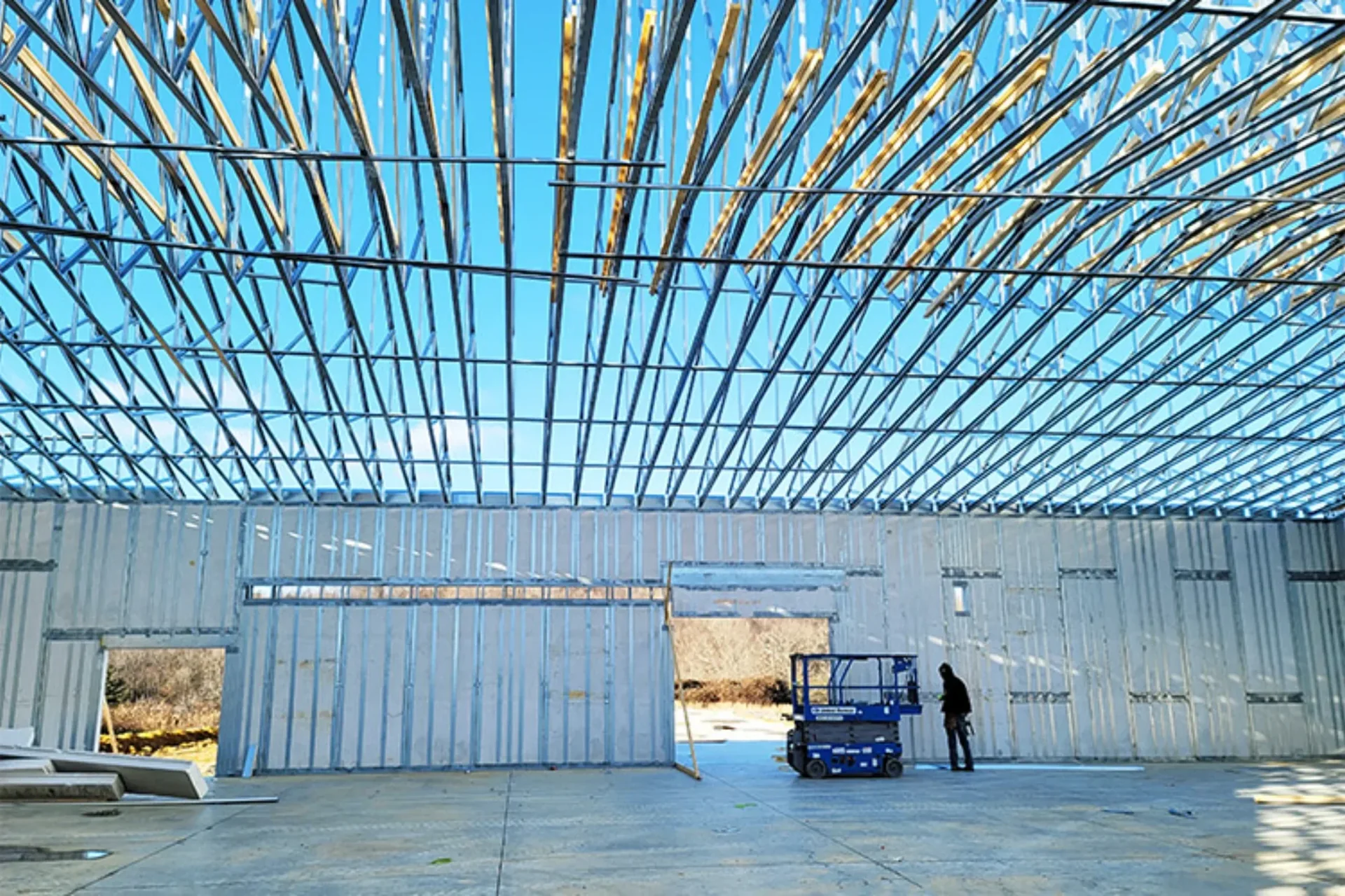 ThermaSteel steel structural panels framing a building under a clear blue sky