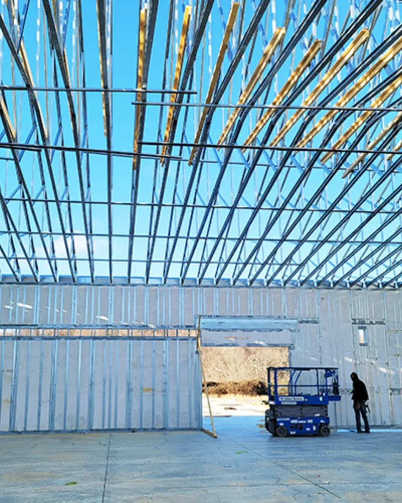 ThermaSteel steel panel framing on a residential job site under a clear blue sky